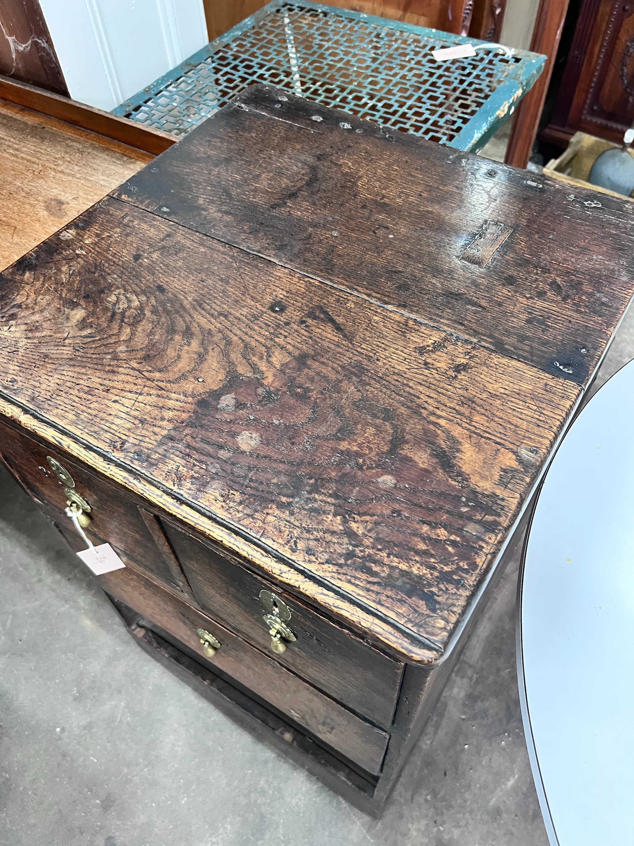 An 18th century oak four drawer chest, (altered) width 54cm *Please note the sale commences at 9am.
